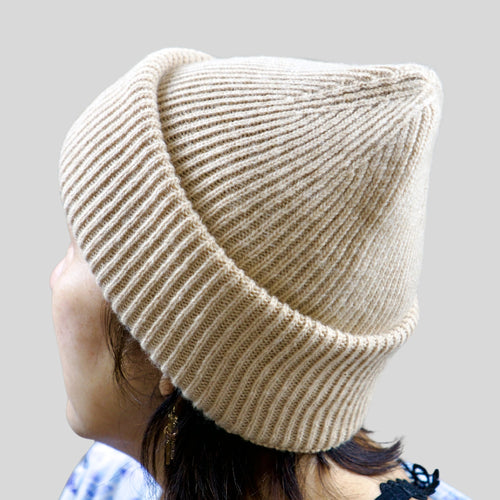 White camel wool beanie showing ribbed crown and fold-over cuff